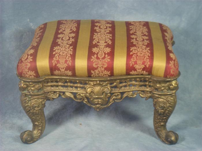 Appraisal: Cast iron Victorian foot stool gold and burgundy upholstery Estimate