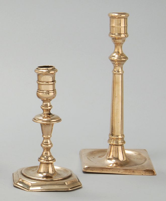 Appraisal: TWO EARLY BELL METAL CANDLESTICKS One possibly Huguenot circa with