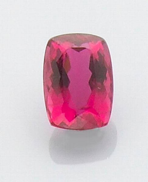 Appraisal: Rubellite Nigeria A delightful cushion-shaped stone having a true reddish-fuchsia