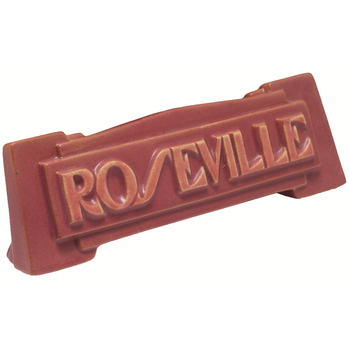 Appraisal: Unusual Roseville sign covered in a pink matt glaze w