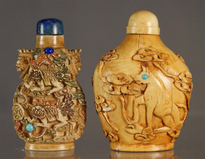 Appraisal: carved ivory snuff bottles w dogs in a landscape split