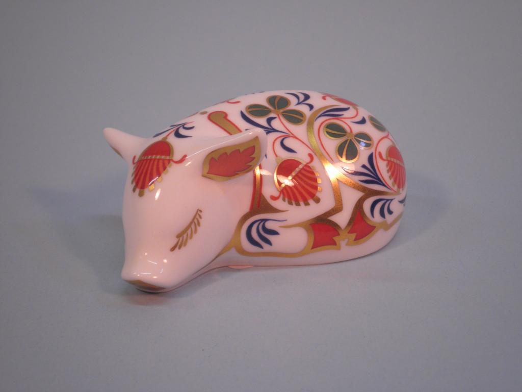 Appraisal: A Royal Crown Derby porcelain figure of a sleeping piglet