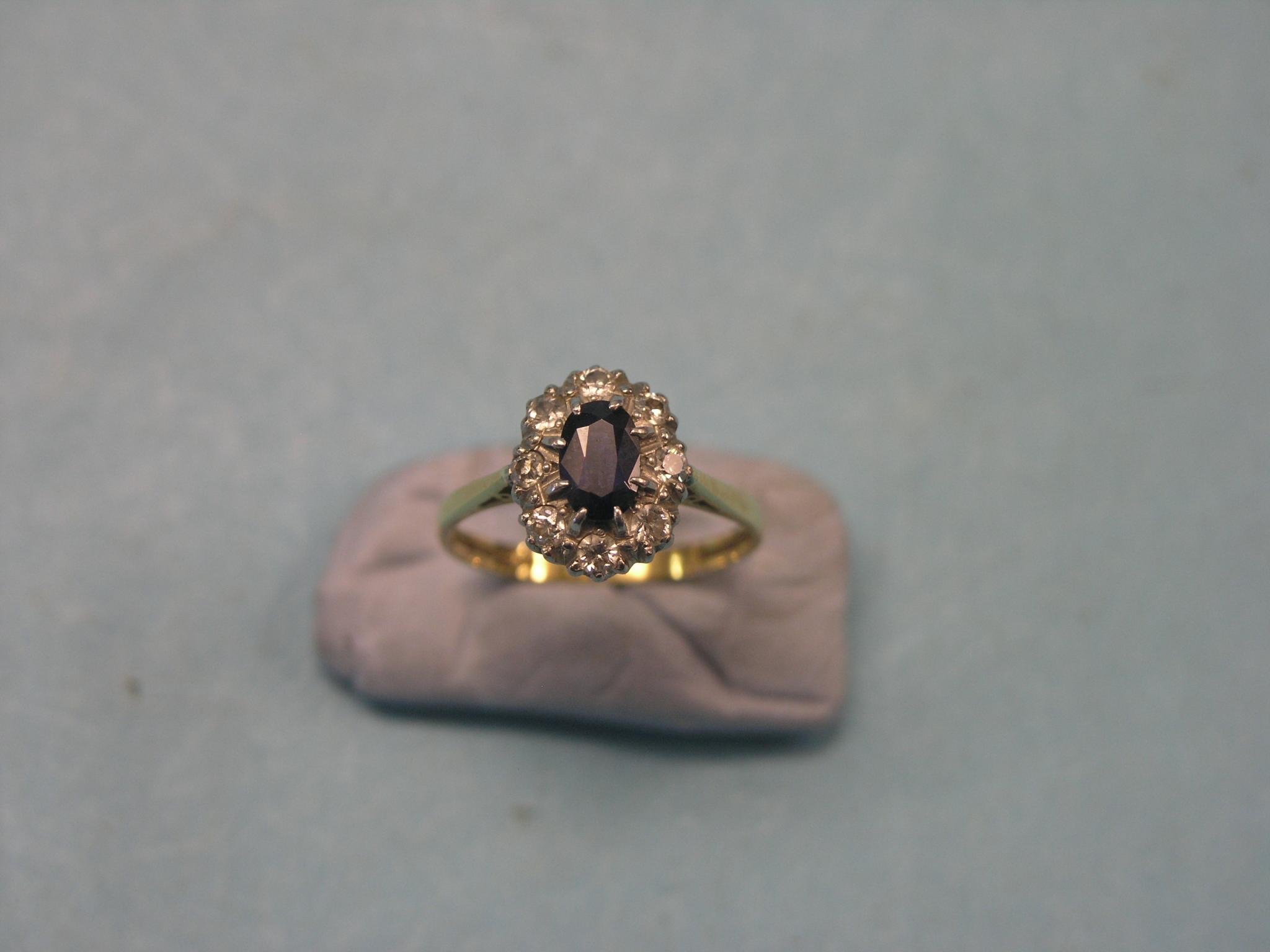 Appraisal: A lady's ct gold diamond and sapphire cluster ring platinum