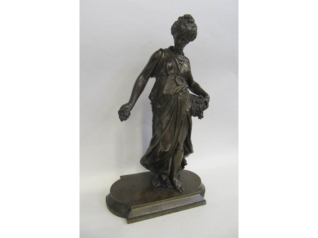 Appraisal: After Paul Duboy patinated sculpture of a lady holding flowers