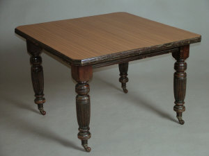 Appraisal: An Edwardian walnut wind-out extending dining table with later applied