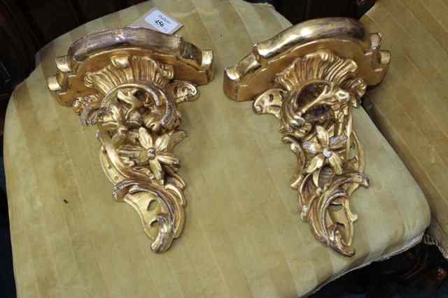 Appraisal: A PAIR OF EARLY TH CENTURY GILT WALL BRACKETS with