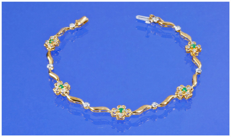 Appraisal: ct Gold Emerald And Diamond Bracelet Five Flower Head Clusters