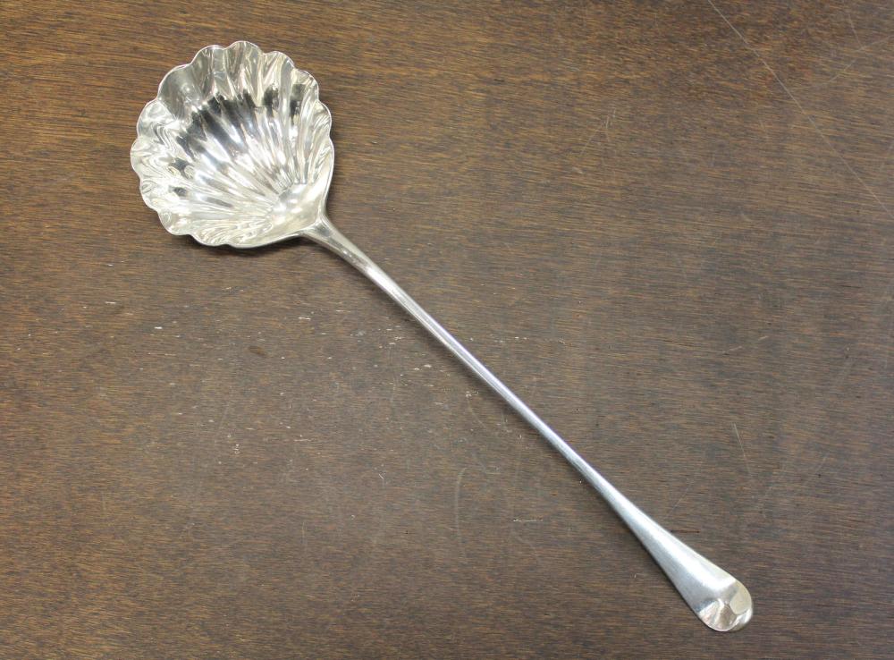 Appraisal: GEORGIAN STERLING SILVER PUNCH LADLE long handle with shell bowl