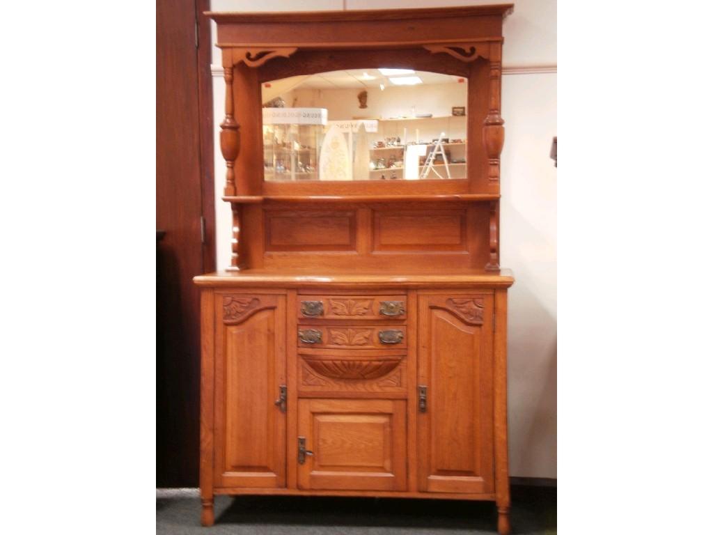 Appraisal: A late thC carved oak mirror back sideboard the base