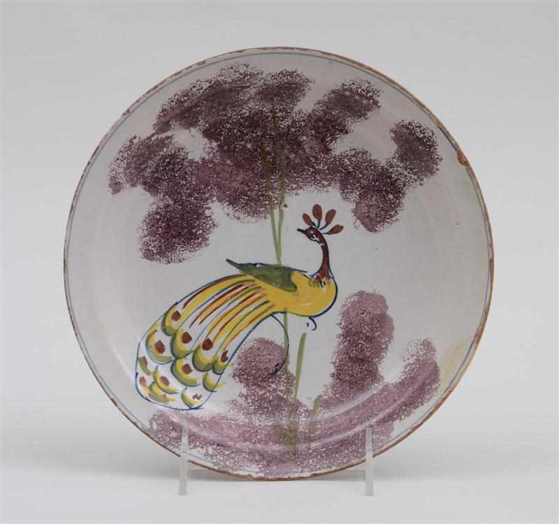 Appraisal: BRISTOL DELFT POLYCHROME DISH Circa - centered by a yellow-plumed