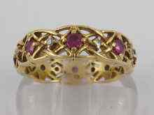 Appraisal: An carat gold diamond and ruby eternity ring with pierced