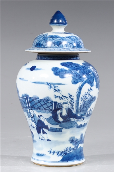 Appraisal: Chinese blue on white ceramic covered urn depicting garden landscape