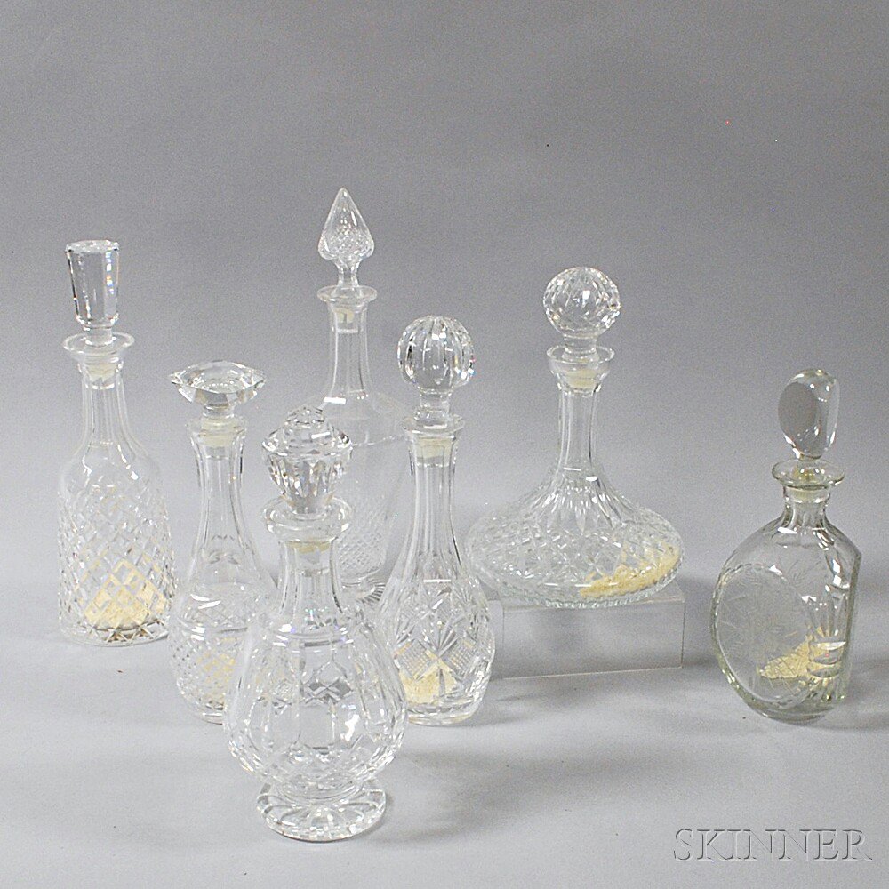 Appraisal: Seven Crystal Decanters th century one marked Waterford ht to