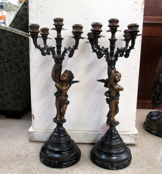 Appraisal: A PAIR OF FIGURAL BRONZE CANDELABRA each accommodating five candlesticks