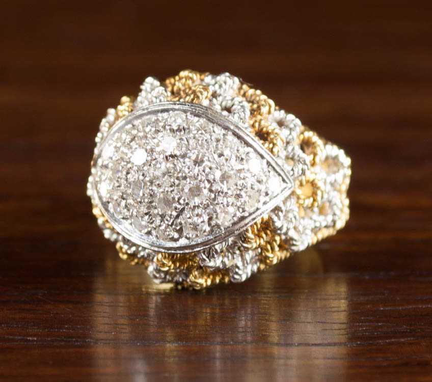 Appraisal: DIAMOND AND EIGHTEEN KARAT GOLD ITALIAN RING The yellow and