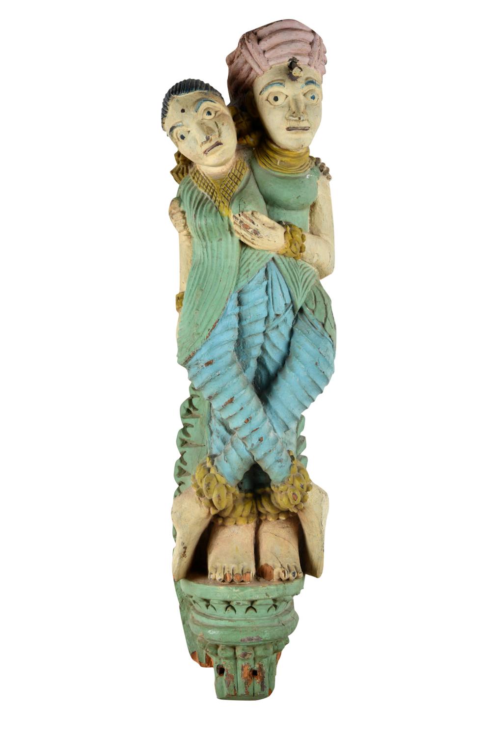 Appraisal: CARVED POLYCHROME-PAINTED INDIAN FIGURAL CARVINGwith metal hanging loop affixed to