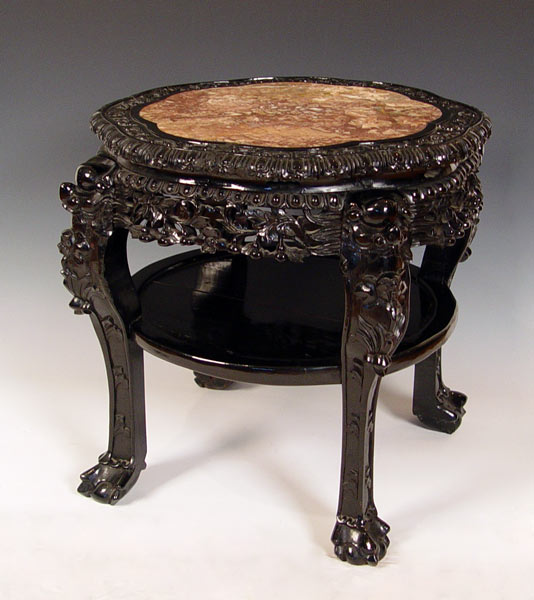 Appraisal: HEAVILY CARVED CHINESE JARDINIERE STAND Recessed marble top ebony finish