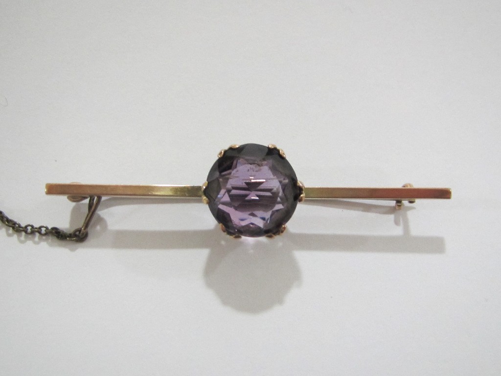 Appraisal: Edwardian rose gold bar brooch with central amethyst inset