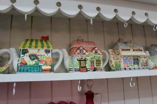 Appraisal: NINE VARIOUS COTTAGE WARE TEAPOTS to include the Railway Station