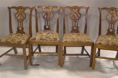 Appraisal: FOUR CHIPPENDALE STYLE SIDE CHAIRS the scrolling crest rails over