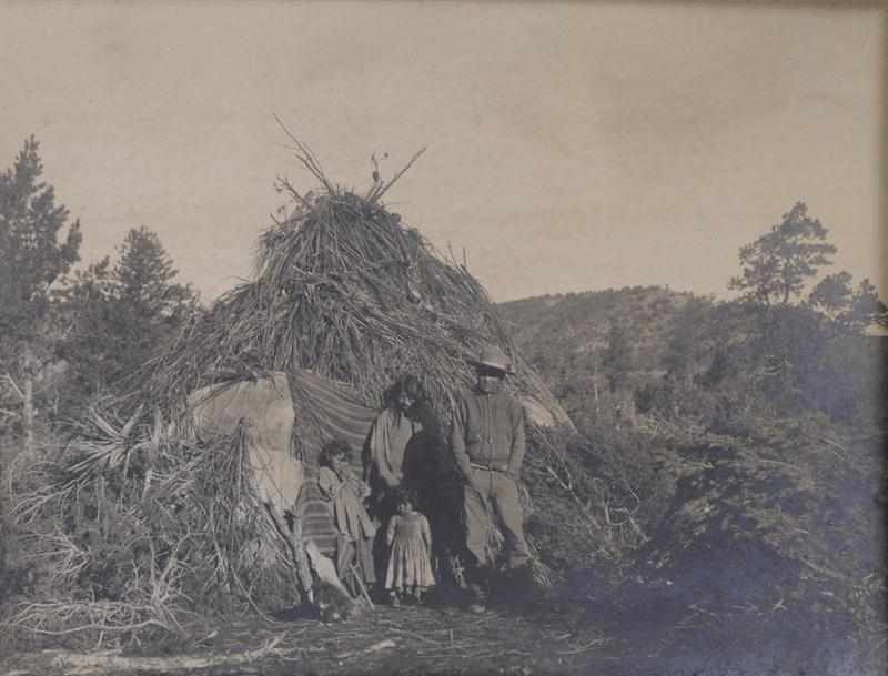 Appraisal: UNKNOWN C APACHE INDIAN FAMILY BY THEIR GRASS HUT Toned