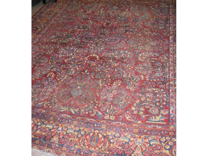 Appraisal: SAROUK ROOM RUG The wine red field of allover curvilinear