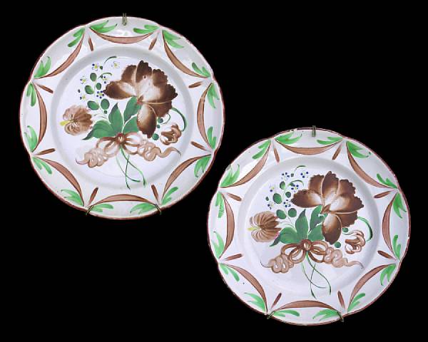 Appraisal: A pair of French faience plates th century Centering a