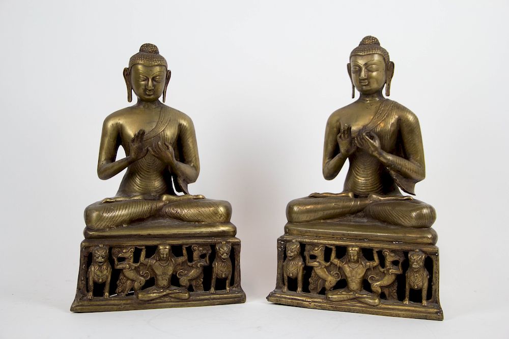 Appraisal: Pair of Brass Buddhas Seated on Lion Platforms From a