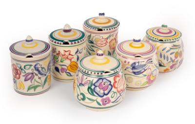 Appraisal: Poole Pottery three floral jam pots and covers cm high