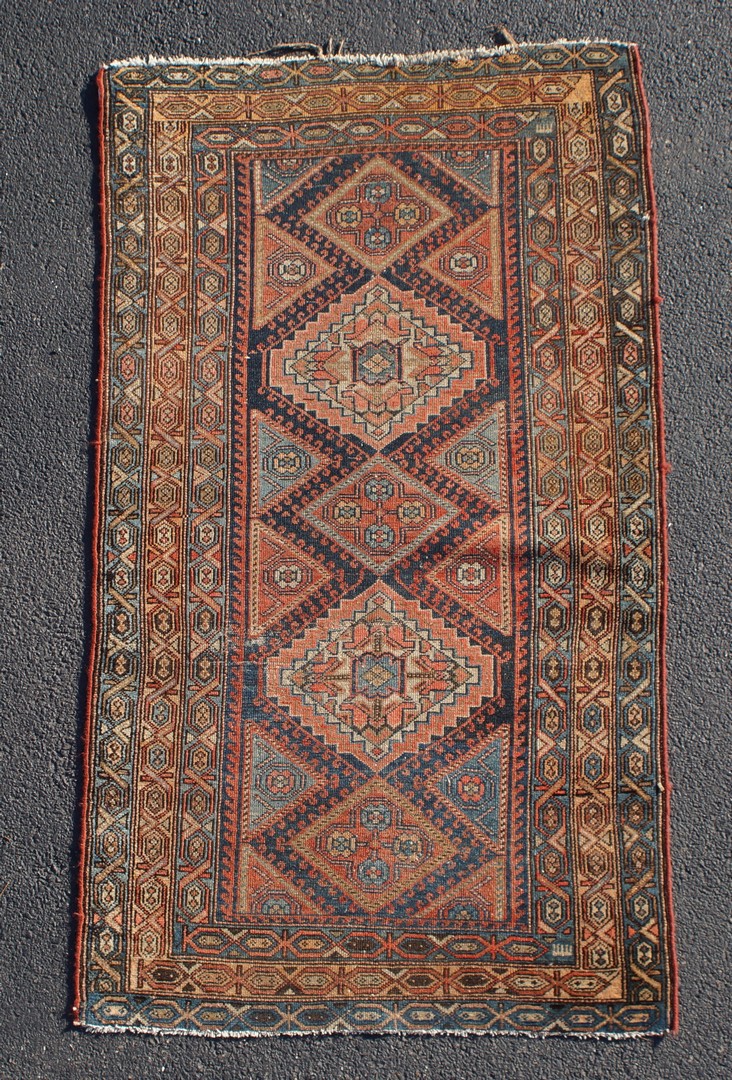 Appraisal: Caucasian carpet evenly worn x