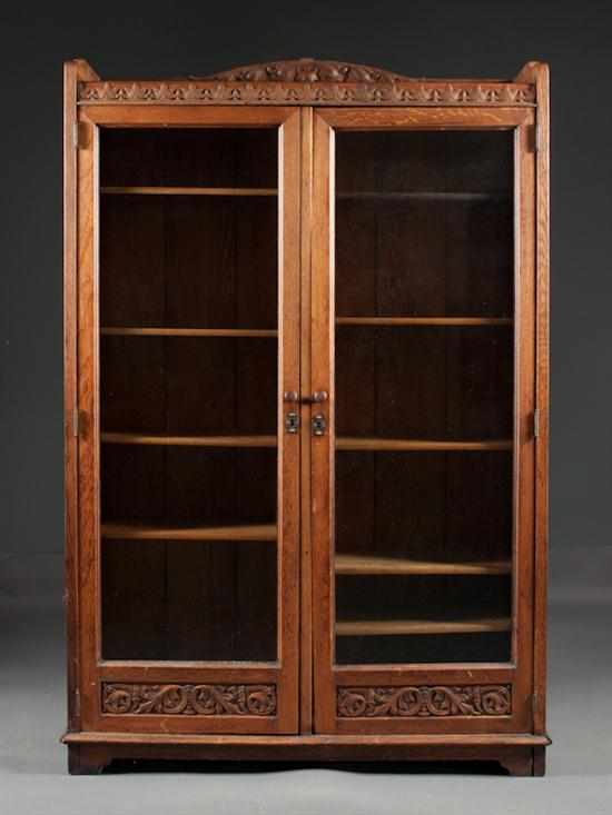 Appraisal: American Arts and Crafts oak glazed panel two-door bookcase early