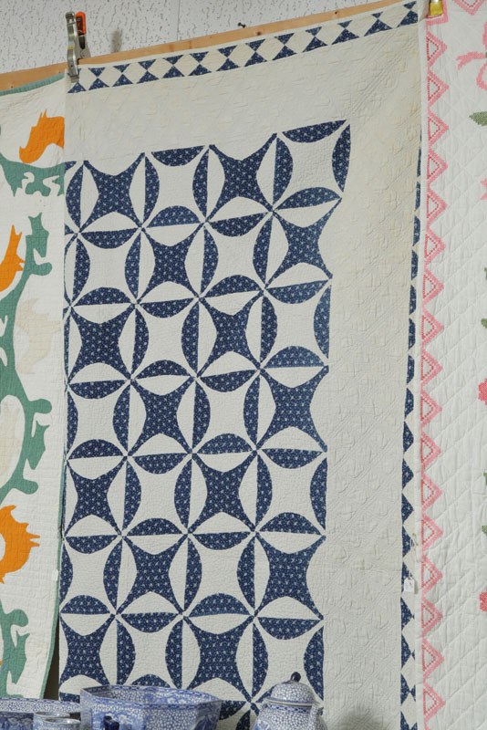 Appraisal: BLUE AND WHITE PIECED QUILT Heavily quilted white cotton ground