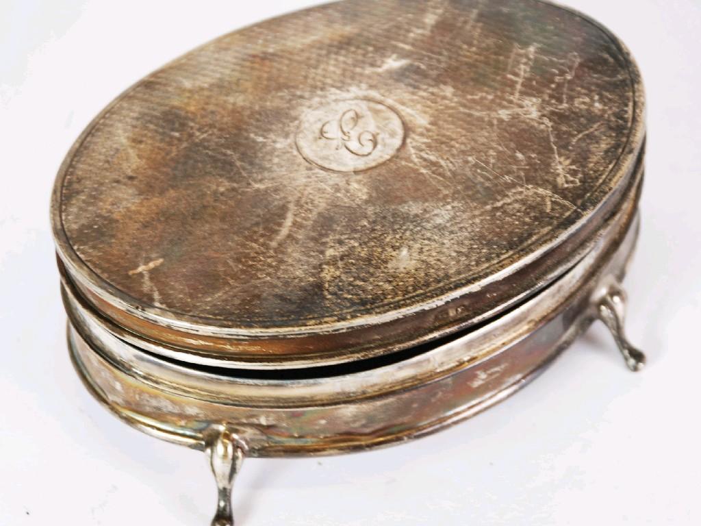 Appraisal: GEORGE V ENGINE TURNED SILVER DRESSING TABLE TRINKET BOX oval