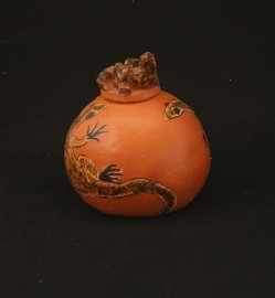 Appraisal: A Hermannsburg Pot with a Lizard Finial hand painted clay