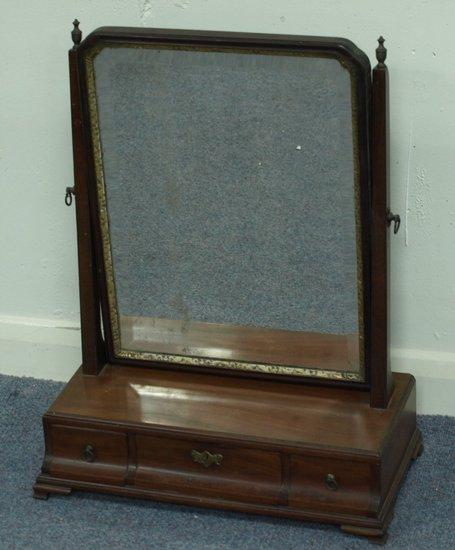 Appraisal: A George III mahogany toilet mirror the bevelled glass with