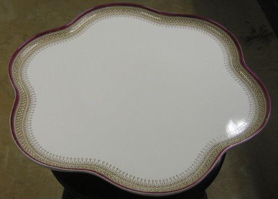 Appraisal: WORCESTER PORCELAIN REVOLVING TRAY Scalloped purple rimmed tray with linear