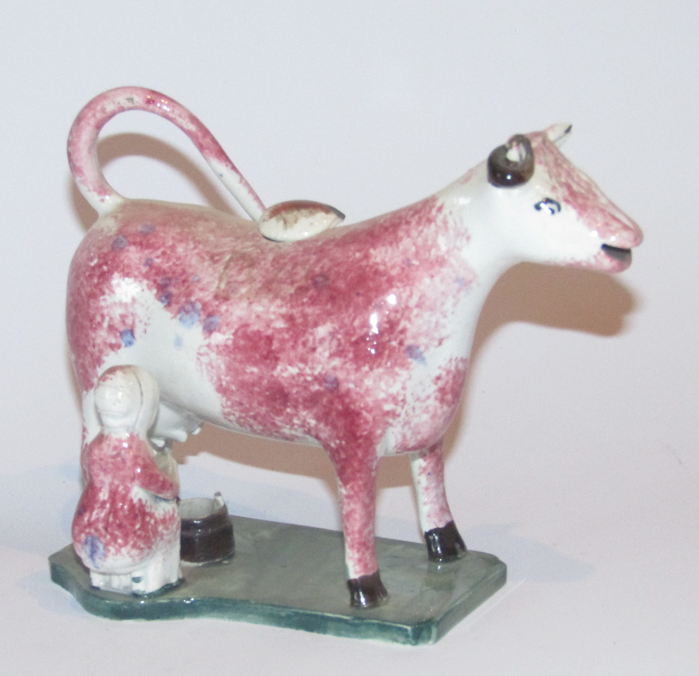 Appraisal: A very early thC Staffordshire pottery cow creamer and milkmaid