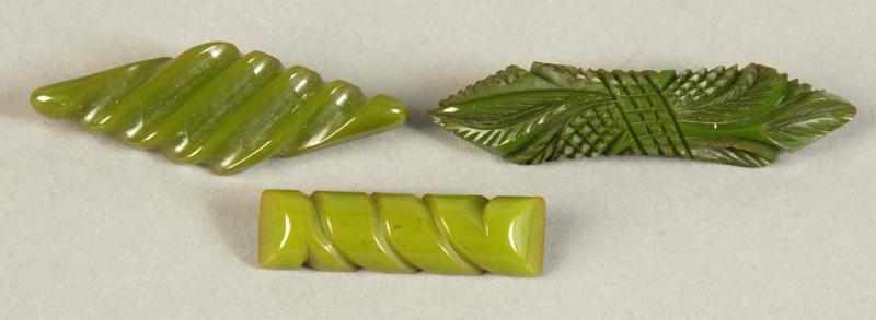 Appraisal: Lot of Green Bakelite Pins Description Includes one carved bar