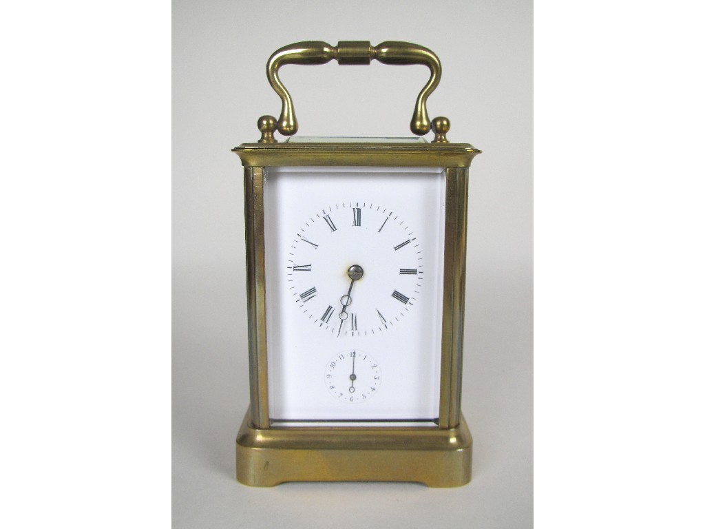 Appraisal: A brass cased carriage clock white enamel dial Roman numerals