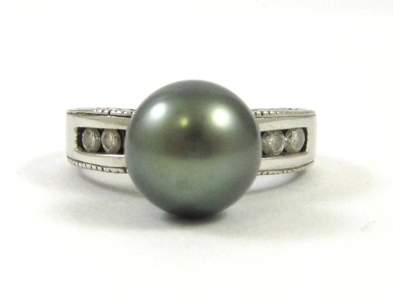 Appraisal: BLACK PEARL DIAMOND AND WHITE GOLD RING The k white