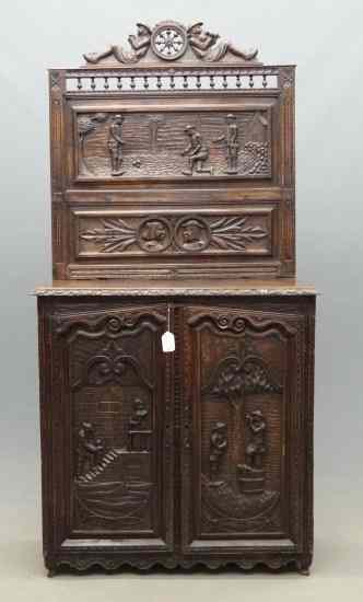 Appraisal: Early Continental carved folk art cabinet having carved panels with