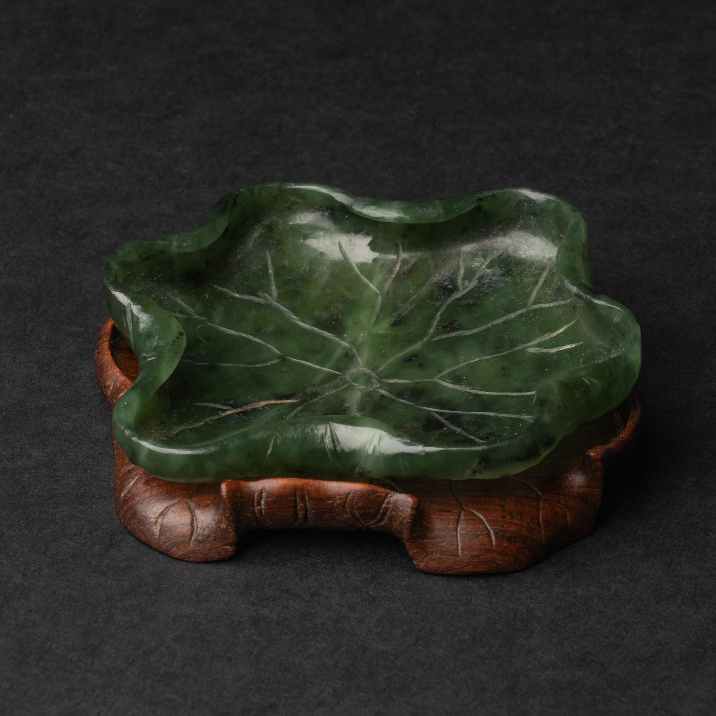 Appraisal: A Spinach Jade Lotus-Form Washer th Century The shape demonstrating