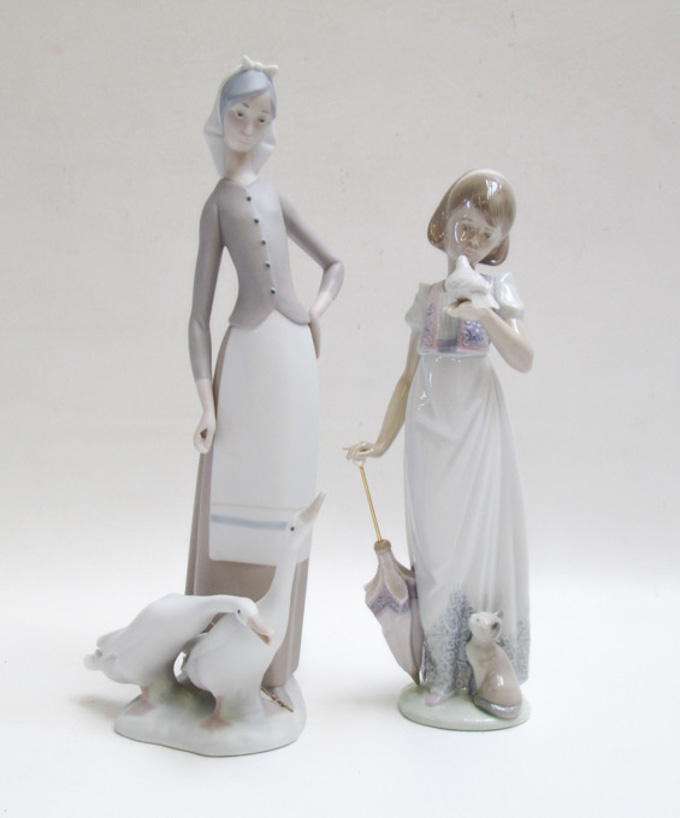 Appraisal: TWO LLADRO PORCELAIN FIGURINES by sculptor Juan Huerta Summer Stroll