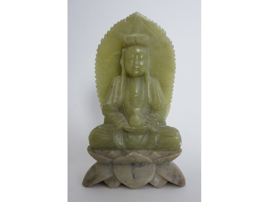 Appraisal: A Chinese jade carving of a Buddha seated on a