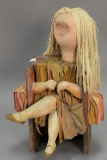 Appraisal: Folkart seated figure carved wood with painted canvas clothes signed