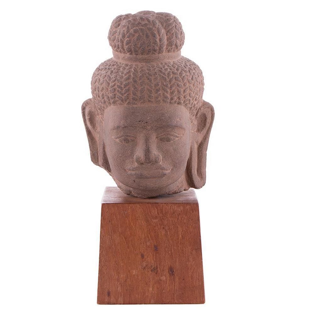 Appraisal: Khmer style carved head Khmer carved stone head on stand