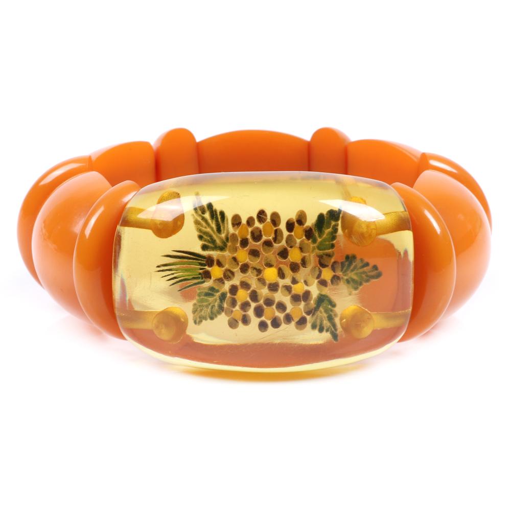 Appraisal: BAKELITE STRETCH WEDGE BRACELET WITH REVERSE CARVED APPLE JUICE PANEL