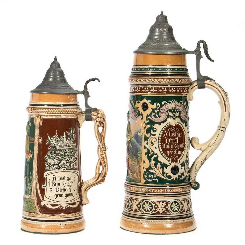 Appraisal: German Ceramic Beer Steins Each decorated with panels of amorous