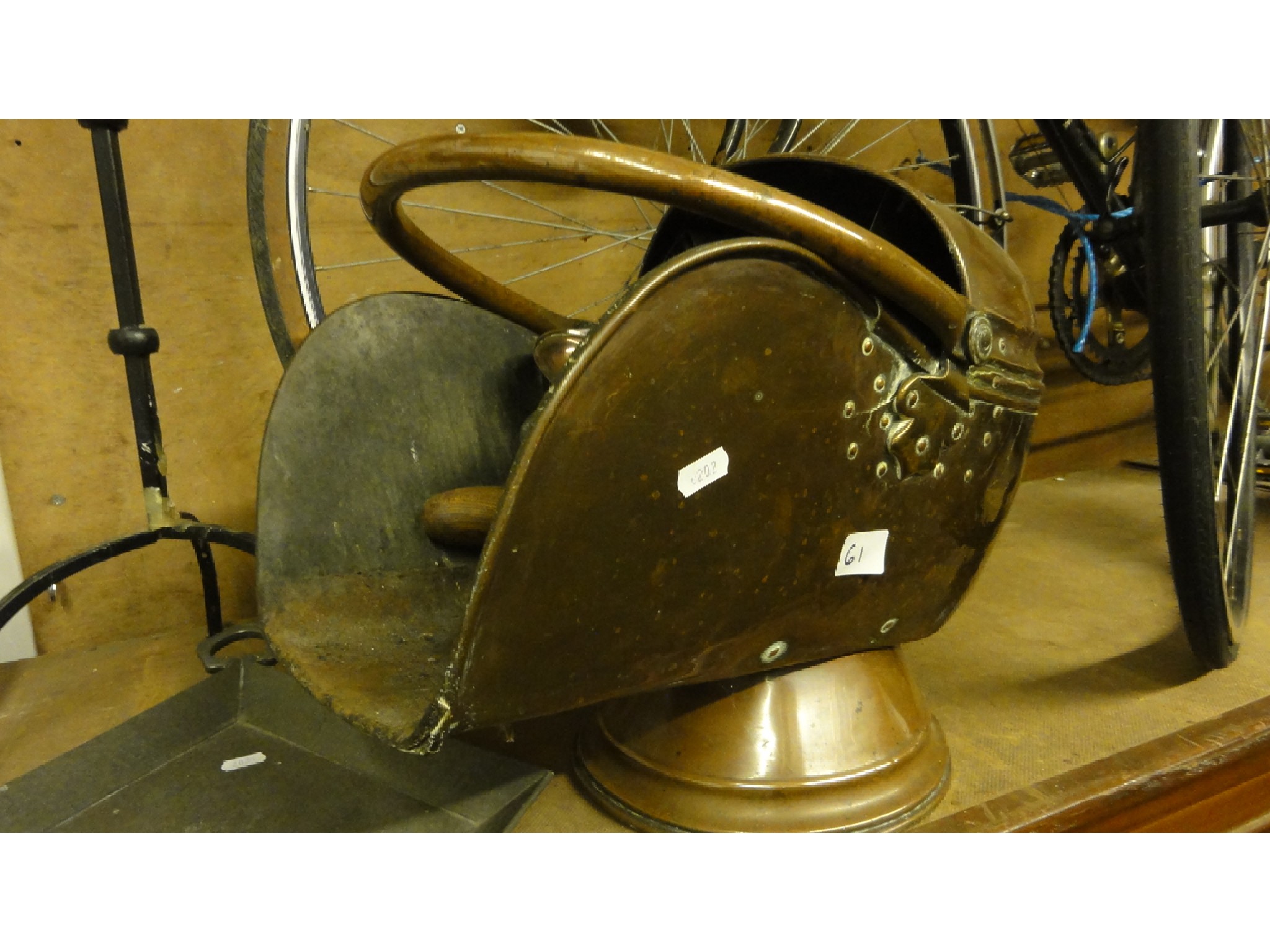 Appraisal: A th century copper helmet shaped coal scuttle with loop