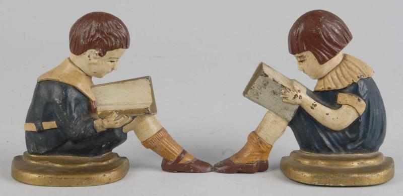 Appraisal: Cast Iron Children Reading Bookends Description Attributed to Spencer Depicts